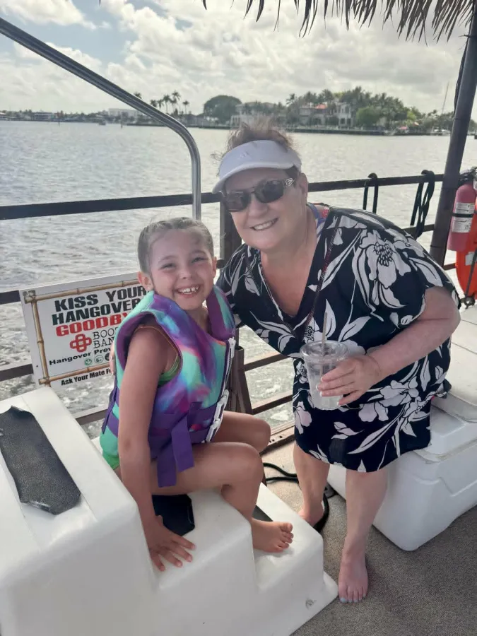 A young guest and mom enjoying a family-friendly Breezy Tiki charter in Fort Lauderdale